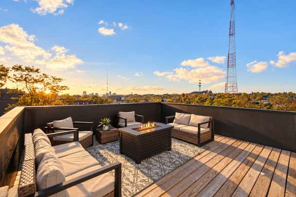 Rooftop Fire Table + Skyline · Near OTR & Stadiums - Image 1